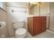 Cozy bathroom featuring a toilet, vanity with storage, and a walk-in shower at 7447 S 25 E, Pendleton, IN 46064