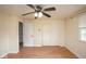 Bedroom with a ceiling fan, window for natural light, and a closet for storage and organization at 7447 S 25 E, Pendleton, IN 46064