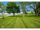 Large front lawn with established trees at 7447 S 25 E, Pendleton, IN 46064