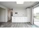 Spacious kitchen featuring white cabinets, ample counter space, and modern lighting fixtures at 7447 S 25 E, Pendleton, IN 46064