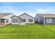 Spacious backyard with green grass, a patio, and views of neighboring homes at 794 Harley Ln, Westfield, IN 46074