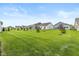 Large backyard with manicured lawn and partial views of houses at 794 Harley Ln, Westfield, IN 46074