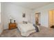 Comfortable bedroom with plush bedding, carpet, and a wooden nightstand at 794 Harley Ln, Westfield, IN 46074