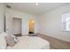 Bright bedroom with plush bedding, ensuite bath, and access to closet at 794 Harley Ln, Westfield, IN 46074
