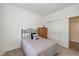 Cozy bedroom with plush carpeting, window, and a wooden dresser at 794 Harley Ln, Westfield, IN 46074