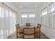 Cozy dining nook featuring a glass table, wood-framed chairs, and natural light at 794 Harley Ln, Westfield, IN 46074
