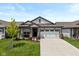 Charming one-story home with well-manicured lawn, garden beds, and a two-car garage at 794 Harley Ln, Westfield, IN 46074