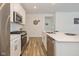 Modern kitchen with stainless steel appliances and sleek countertops; a perfect place to cook at 794 Harley Ln, Westfield, IN 46074