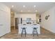 Modern kitchen with white cabinets, stainless steel appliances, and a functional center island at 794 Harley Ln, Westfield, IN 46074