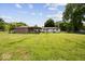 Large backyard with a well-maintained lawn and mature trees at 8244 E Hadley Rd, Camby, IN 46113