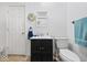 Bathroom features a black vanity with a white countertop and a toilet at 8244 E Hadley Rd, Camby, IN 46113