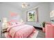 Pink bedroom with pink decorations and a cozy pink bed at 8244 E Hadley Rd, Camby, IN 46113
