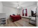 Simple bedroom featuring hardwood floors, white walls, and neutral accents at 8244 E Hadley Rd, Camby, IN 46113
