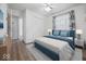 Nicely decorated bedroom with a large comfortable bed, wood floor, and a ceiling fan at 8244 E Hadley Rd, Camby, IN 46113