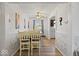 Bright dining area showcasing a white textured wall, seating for six, and natural light at 8244 E Hadley Rd, Camby, IN 46113