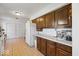 Eat-in kitchen featuring warm cabinets, white appliances, and easy access to the dining room at 8244 E Hadley Rd, Camby, IN 46113