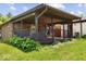 Enjoy outdoor relaxation on this home's covered patio, great for entertaining and relaxation at 8244 E Hadley Rd, Camby, IN 46113