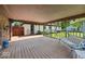 Spacious covered porch with a swing and a view of the backyard at 8244 E Hadley Rd, Camby, IN 46113