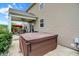 Exterior of home highlighting backyard space with hot tub and covered patio area at 916 Settlers Walk, Brownsburg, IN 46112
