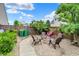 Backyard with a fire pit, seating area, gravel, landscaping, and wood fence at 916 Settlers Walk, Brownsburg, IN 46112