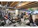 Unfinished basement; exposed beams and equipment hint at potential for storage or customization; cluttered with various belongings at 916 Settlers Walk, Brownsburg, IN 46112