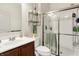 Clean bathroom features glass enclosed shower and vanity with sink at 916 Settlers Walk, Brownsburg, IN 46112