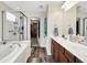 Bright bathroom with double vanity, soaking tub and glass enclosed shower at 916 Settlers Walk, Brownsburg, IN 46112