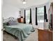 Comfortable bedroom with a wrought iron bed, neutral walls and carpet at 916 Settlers Walk, Brownsburg, IN 46112