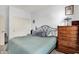 Cozy bedroom with a full size bed, matching wooden dresser, and a closet at 916 Settlers Walk, Brownsburg, IN 46112