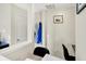 Hallway with coat hooks and access to a bright, naturally lit room at 916 Settlers Walk, Brownsburg, IN 46112