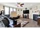 Cozy living room featuring a fireplace, TV, and comfortable seating with a ceiling fan at 916 Settlers Walk, Brownsburg, IN 46112