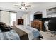 Cozy main bedroom with en-suite access, media center, and decorative pillows at 916 Settlers Walk, Brownsburg, IN 46112