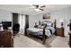 Comfortable main bedroom with a ceiling fan and decorative wall art at 916 Settlers Walk, Brownsburg, IN 46112