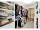 Well-organized walk-in closet with shelving and hanging rods at 916 Settlers Walk, Brownsburg, IN 46112