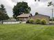 Backyard with an above-ground pool and well-manicured lawn and landscaping at 9467 N Michigan Rd, Fairland, IN 46126