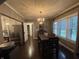 Elegant dining room with hardwood floors, chandelier, and plenty of natural light at 9467 N Michigan Rd, Fairland, IN 46126