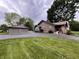 Charming home with a detached garage, circular driveway, and well-maintained lawn at 9467 N Michigan Rd, Fairland, IN 46126