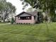 Charming single-story home with a well-maintained lawn and inviting front porch at 9467 N Michigan Rd, Fairland, IN 46126