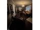Cozy living room with hardwood floors, chandelier and comfortable seating at 9467 N Michigan Rd, Fairland, IN 46126