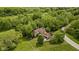 Aerial view of home, showcasing mature trees and beautiful landscaping at 9601 Irishmans Run Ln, Zionsville, IN 46077