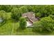 Overhead view of the house showing the well-maintained lawn and mature trees at 9601 Irishmans Run Ln, Zionsville, IN 46077