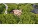 Stunning aerial view of a large estate home with a pond and lush landscaping at 9601 Irishmans Run Ln, Zionsville, IN 46077