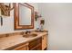 Rustic bathroom featuring a copper sink, unique mirror, and stylish fixtures at 9601 Irishmans Run Ln, Zionsville, IN 46077