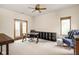 Spacious bedroom with modern desk, seating, and balcony access at 9601 Irishmans Run Ln, Zionsville, IN 46077