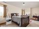 Charming bedroom with a cozy bed, accented with decorative pillows, next to a window providing natural light at 9601 Irishmans Run Ln, Zionsville, IN 46077