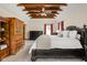 Main bedroom featuring trey ceiling with exposed beams and carpet flooring at 9601 Irishmans Run Ln, Zionsville, IN 46077