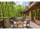 Relaxing deck with comfortable seating and views of the lush greenery and mature trees at 9601 Irishmans Run Ln, Zionsville, IN 46077