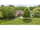 Beautiful home surrounded by lush greenery and mature trees, offering privacy and tranquility at 9601 Irishmans Run Ln, Zionsville, IN 46077