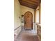 The arched front door provides a timeless, inviting entry at 9601 Irishmans Run Ln, Zionsville, IN 46077