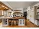 Kitchen island featuring seating, terracotta countertops, and an open floor plan design, perfect for entertaining guests at 9601 Irishmans Run Ln, Zionsville, IN 46077